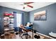 Functional office space with a ceiling fan, desk, and organization for a productive work environment at 1603 Fluorshire Dr, Brandon, FL 33511