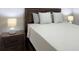Relaxing bedroom with a wood headboard and two nightstands at 17099 Carleen Ave, Port Charlotte, FL 33948