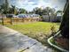 The backyard features new grass and a new wooden fence, offering a private outdoor space at 1906 E 98Th Ave, Tampa, FL 33612
