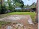 Large backyard featuring grass and concrete slab at 1906 E 98Th Ave, Tampa, FL 33612