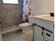 Bathroom with a modern vanity, stylish tile, and a walk-in shower at 1906 E 98Th Ave, Tampa, FL 33612