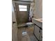 Bathroom featuring a modern vanity, stylish tile, and a walk-in shower at 1906 E 98Th Ave, Tampa, FL 33612