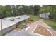 An aerial view of the home with an expansive yard, garden and mature trees at 1931 Jaudon Rd, Dover, FL 33527