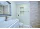 Modern bathroom features a white vanity and tiled shower at 1931 Jaudon Rd, Dover, FL 33527