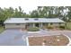 A well-maintained home with a lush front garden and driveway at 1931 Jaudon Rd, Dover, FL 33527