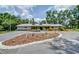 Beautifully landscaped front yard with a circular driveway and a charming single-story home at 1931 Jaudon Rd, Dover, FL 33527