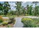 Beautifully landscaped front yard with mature plants leading to a well-maintained home at 1931 Jaudon Rd, Dover, FL 33527