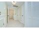 Hallway with multiple doors and tiled floors at 1931 Jaudon Rd, Dover, FL 33527