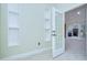 Hallway features an open door leading to a kitchen at 1931 Jaudon Rd, Dover, FL 33527