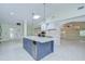 Modern kitchen with center island, stainless appliances, granite countertops, and ample lighting at 1931 Jaudon Rd, Dover, FL 33527