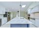 Gourmet kitchen with marble countertops, island with seating, and stainless steel appliances at 1931 Jaudon Rd, Dover, FL 33527
