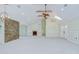 Bright living room with stone accent wall, fireplace, and beautiful vaulted ceiling at 1931 Jaudon Rd, Dover, FL 33527