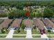 Aerial view showing property location in a neighborhood with tree coverage at 26501 Whirlaway Ter, Wesley Chapel, FL 33544