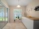 Bright breakfast nook with a sliding door to the outdoors with tile flooring at 26501 Whirlaway Ter, Wesley Chapel, FL 33544