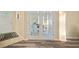 Home entryway with patterned rug, tile and laminate floors, and view of French doors to an office at 26501 Whirlaway Ter, Wesley Chapel, FL 33544