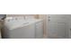 Convenient laundry room with washer, dryer, and access to the outside at 26501 Whirlaway Ter, Wesley Chapel, FL 33544