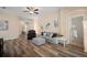 Cozy living room with modern flooring, ceiling fan, and a comfortable seating area at 26501 Whirlaway Ter, Wesley Chapel, FL 33544