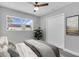 Comfortable bedroom featuring a ceiling fan, closet, and natural light from a window at 2711 E 22Nd Ave, Tampa, FL 33605