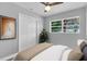Relaxing bedroom featuring a ceiling fan, closet, and a comforting decor at 2711 E 22Nd Ave, Tampa, FL 33605