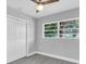 Bedroom features a ceiling fan, natural light, and closet at 2711 E 22Nd Ave, Tampa, FL 33605
