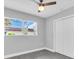 Bright bedroom with a ceiling fan, natural light, and closet at 2711 E 22Nd Ave, Tampa, FL 33605