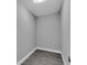 A shot of a simple empty closet with gray walls and light flooring at 2711 E 22Nd Ave, Tampa, FL 33605