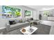 Bright living room with large windows, comfortable seating, and modern decor at 2711 E 22Nd Ave, Tampa, FL 33605