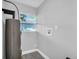 Utility room with window, hookups, and water heater at 2711 E 22Nd Ave, Tampa, FL 33605