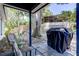 Cozy covered patio featuring a grill, outdoor seating, and a view of the backyard at 2721 Baird Ct, Palm Harbor, FL 34684