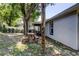 Home exterior featuring picnic table in yard with view of the home at 2721 Baird Ct, Palm Harbor, FL 34684