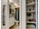Bathroom featuring vanity with modern sink, toilet and shower with green shower curtain at 2721 Baird Ct, Palm Harbor, FL 34684