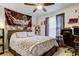 Cozy bedroom with a comfortable bed, ceiling fan, and ample natural light from the windows at 2721 Baird Ct, Palm Harbor, FL 34684