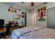 Bright bedroom featuring a bed, a ceiling fan, and a work space at 2721 Baird Ct, Palm Harbor, FL 34684