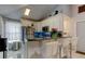 Modern kitchen with stainless steel appliances, breakfast bar, and stylish finishes at 2721 Baird Ct, Palm Harbor, FL 34684