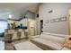 Open concept living room and kitchen with bar stool seating and vaulted ceiling at 2721 Baird Ct, Palm Harbor, FL 34684