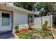 Charming side yard featuring a well-manicured garden area and privacy fence at 2721 Baird Ct, Palm Harbor, FL 34684