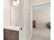 Updated bathroom featuring sleek vanity with modern fixtures and ample storage at 3023 Minuteman Ln, Brandon, FL 33511