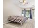 Spacious bedroom with a ceiling fan and sliding glass doors leading to the backyard at 3023 Minuteman Ln, Brandon, FL 33511