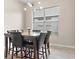 Bright dining room featuring a marble table set and large window at 3023 Minuteman Ln, Brandon, FL 33511