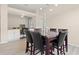Dining area featuring a marble table and chairs, complemented by hardwood floors at 3023 Minuteman Ln, Brandon, FL 33511