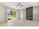 Bright living room with fireplace and sliding glass doors leading to the backyard at 3023 Minuteman Ln, Brandon, FL 33511
