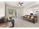 Living room featuring hardwood floors, neutral walls, and a patio view at 3023 Minuteman Ln, Brandon, FL 33511