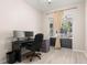 Home office with large windows, desk, and outdoor patio at 3023 Minuteman Ln, Brandon, FL 33511