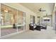 Covered patio has ceiling fans and outdoor seating, perfect for entertaining guests at 3023 Minuteman Ln, Brandon, FL 33511
