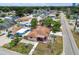 An aerial view showcasing the home's location within the neighborhood, highlighting nearby streets and mature trees at 3324 W Saint Joseph St, Tampa, FL 33607