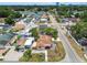 An aerial view showing the house in relation to the neighborhood with mature trees at 3324 W Saint Joseph St, Tampa, FL 33607