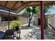 Backyard featuring detached shed and mature trees, with patio table at 3324 W Saint Joseph St, Tampa, FL 33607