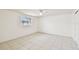 Bright bedroom with a ceiling fan and a window with decorative bars at 3324 W Saint Joseph St, Tampa, FL 33607