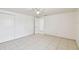 Clean bedroom showcasing tile flooring and a closet with sliding doors at 3324 W Saint Joseph St, Tampa, FL 33607