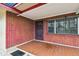 Covered entrance featuring brick walls, a secure metal door, and tiled flooring at 3324 W Saint Joseph St, Tampa, FL 33607